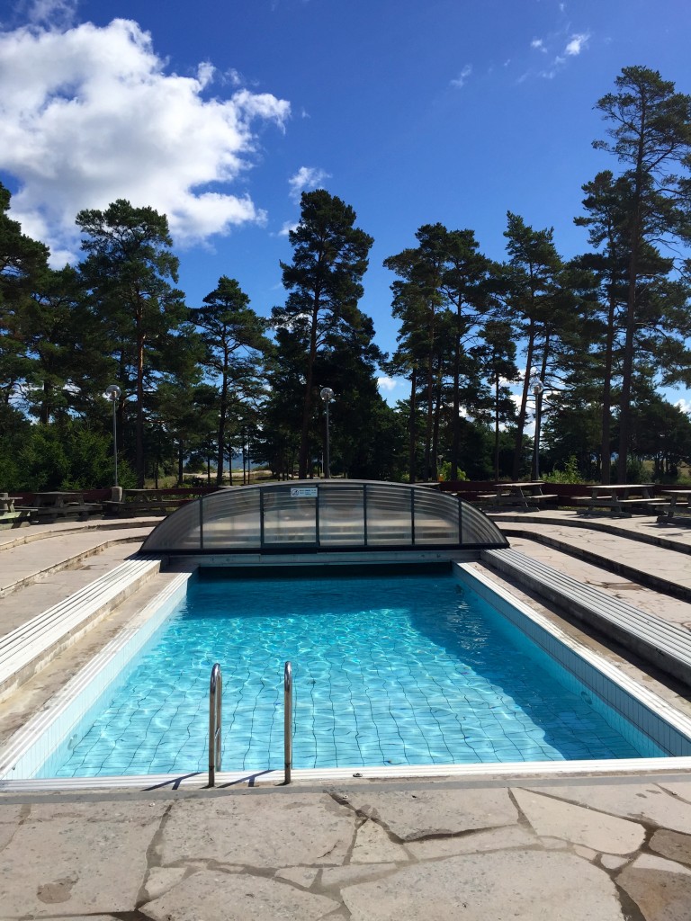 This camping next to the beach has a pool. With a roof that is. We are in Sweden.